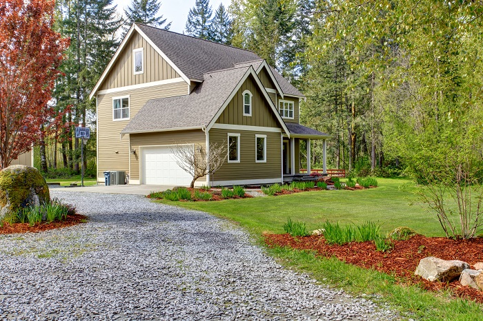 House with gravel driveway.