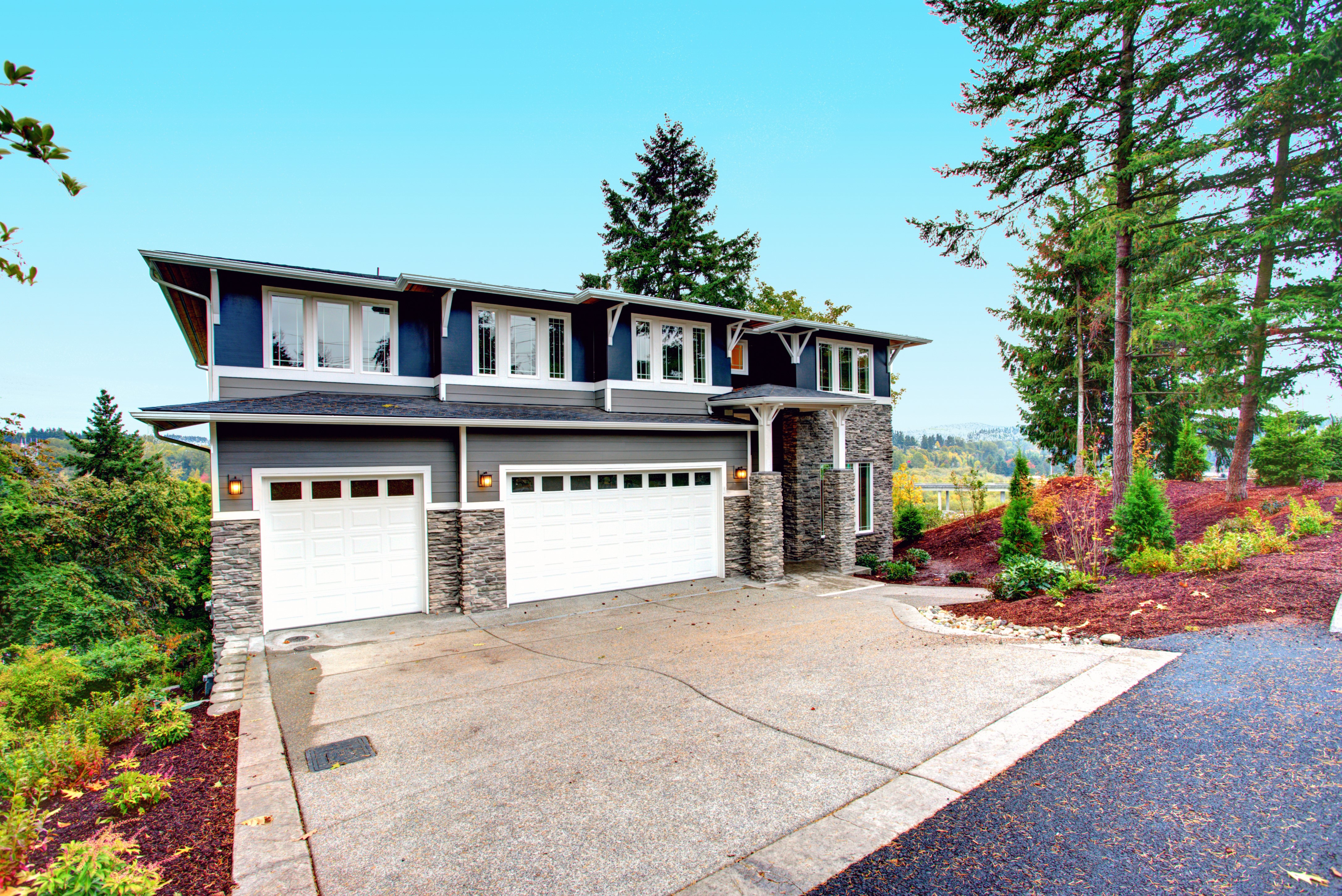 Home with a concrete driveway.