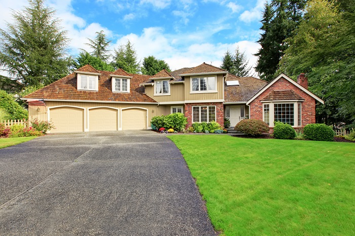 House with asphalt driveway.